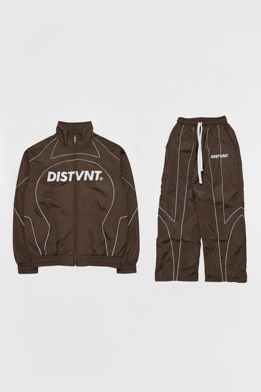 Brown jacket and pants set with 'DISTVNT' branding on a light gray background
